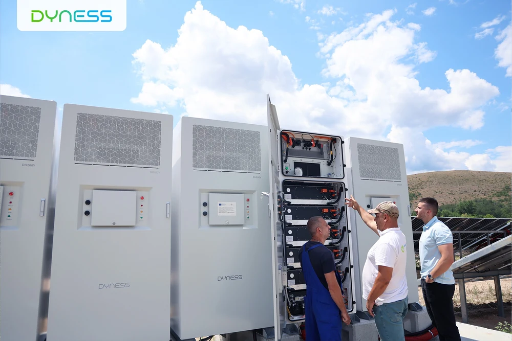 Technicians inspect an open DH200Y system