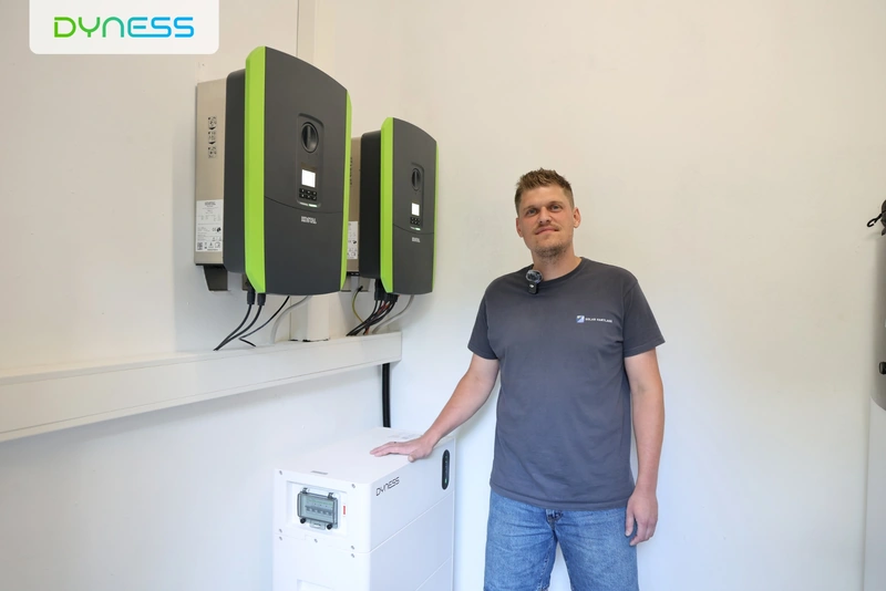 Installer beside KOSTAL inverters and a Dyness home energy storage system Installer beside KOSTAL inverters and a Dyness home energy storage system